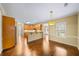 Open kitchen with granite countertops, stainless steel appliances, and hardwood floors at 1105 Fountain Head Ln, Lawrenceville, GA 30043