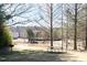 Picturesque picnic area by the pond with a charcoal grill, inviting relaxation and outdoor dining at 1105 Fountain Head Ln, Lawrenceville, GA 30043