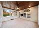 Enclosed sunroom with wood ceiling, tile flooring, and lots of natural light at 1105 Fountain Head Ln, Lawrenceville, GA 30043