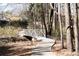Serene walking trail with a quaint wooden bridge, perfect for enjoying nature within the community at 1105 Fountain Head Ln, Lawrenceville, GA 30043