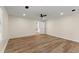 Spacious bedroom with modern ceiling fan, hardwood floors, and bright natural light at 2011 Panola Rd, Lithonia, GA 30058