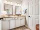 Bathroom with granite countertops, double sinks, and modern fixtures at 3557 Ashcroft Se Dr, Smyrna, GA 30080