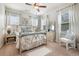 Cozy bedroom with large windows providing natural light and a comfortable bed at 3557 Ashcroft Se Dr, Smyrna, GA 30080