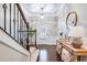 Elegant foyer featuring hardwood floors, staircase, and stylish decor at 3557 Ashcroft Se Dr, Smyrna, GA 30080