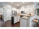 Modern kitchen with granite countertops, stainless steel appliances, and a functional island at 3557 Ashcroft Se Dr, Smyrna, GA 30080