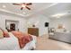 Spacious main bedroom with sitting area, tray ceiling, and adjoining bonus room at 3557 Ashcroft Se Dr, Smyrna, GA 30080