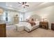 The main bedroom features tray ceilings, an upholstered headboard, and neutral decor at 3557 Ashcroft Se Dr, Smyrna, GA 30080