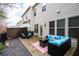 Back patio featuring stone flooring and an outdoor seating area with a fire pit at 3557 Ashcroft Se Dr, Smyrna, GA 30080