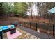 Back patio featuring an outdoor seating area, a grill, and a retaining wall at 3557 Ashcroft Se Dr, Smyrna, GA 30080