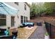 Back patio featuring stone flooring, an outdoor seating area and a grill at 3557 Ashcroft Se Dr, Smyrna, GA 30080