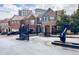 Street view of brick townhomes with a gated entrance at 3557 Ashcroft Se Dr, Smyrna, GA 30080