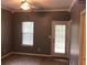 Cozy bedroom with neutral walls, outdoor access, carpet flooring, and a ceiling fan at 1466 Andrews Nw St, Atlanta, GA 30314