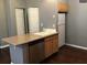 Efficient kitchen layout with a stainless dishwasher, and bright wood cabinetry at 1466 Andrews Nw St, Atlanta, GA 30314