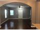 Spacious living room with hardwood floors, a large archway, and a ceiling fan at 1466 Andrews Nw St, Atlanta, GA 30314