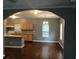 Open floor plan featuring hardwood floors, view of the kitchen, and natural light at 1466 Andrews Nw St, Atlanta, GA 30314