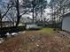 Backyard featuring a trampoline, and ample space, ideal for outdoor activities and recreation at 3356 Hollow Ct, Lawrenceville, GA 30044