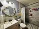 Bathroom featuring a stylish vanity with a decorative mirror, offering a bright and inviting space at 3356 Hollow Ct, Lawrenceville, GA 30044