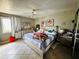 Spacious bedroom with a ceiling fan and ample natural light, creating a comfortable and relaxing atmosphere at 3356 Hollow Ct, Lawrenceville, GA 30044