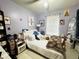 Cozy bedroom featuring white furniture, soft lighting, and tasteful decor for a comfortable and inviting space at 3356 Hollow Ct, Lawrenceville, GA 30044