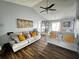 Inviting living room featuring vaulted ceilings, hardwood floors, two comfortable sofas, and stylish decor with natural light at 3356 Hollow Ct, Lawrenceville, GA 30044