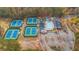 Aerial view of community amenities including tennis courts, pool, lazy river, clubhouse, and parking at 583 Carl Sanders Dr, Acworth, GA 30101
