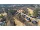 Aerial view of new construction homes in an upscale golf community surrounded by trees at 583 Carl Sanders Dr, Acworth, GA 30101