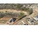 Aerial view of an upscale community with a golf course surrounded by many bare trees at 583 Carl Sanders Dr, Acworth, GA 30101