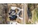 Aerial view of a modern home with beautiful landscaping, a circular driveway, and a view of the neighborhood at 583 Carl Sanders Dr, Acworth, GA 30101