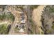 Aerial view of golf course homes with landscaping and circular drives in a wooded community at 583 Carl Sanders Dr, Acworth, GA 30101