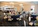 Grand banquet hall with tables decorated with elegant flower arrangements and crystal chandeliers at 583 Carl Sanders Dr, Acworth, GA 30101