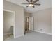 Spacious bedroom with a ceiling fan and access to an en-suite bathroom at 583 Carl Sanders Dr, Acworth, GA 30101