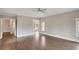 Bedroom features hardwood floors with neutral walls and views to a large bathroom at 583 Carl Sanders Dr, Acworth, GA 30101