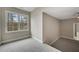 Neutral bedroom with a large window offering ample natural light and plush carpeting at 583 Carl Sanders Dr, Acworth, GA 30101