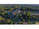 Aerial view of the Governors Towne Club stately white clubhouse with portico and lush landscaping at 583 Carl Sanders Dr, Acworth, GA 30101