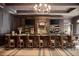 Elegant clubhouse bar with dark wood, granite counter top, leather chairs, tvs, and liquor shelves at 583 Carl Sanders Dr, Acworth, GA 30101