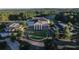 Aerial view of the Governors Towne Club stately white clubhouse with portico and manicured landscaping at 583 Carl Sanders Dr, Acworth, GA 30101