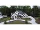 Stunning two-story home featuring a circular driveway and beautifully landscaped front yard at 583 Carl Sanders Dr, Acworth, GA 30101