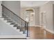 Inviting foyer featuring hardwood floors, staircase, and transom-windowed front doors at 583 Carl Sanders Dr, Acworth, GA 30101