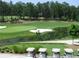 Golf course with water feature and golf carts parked nearby at 583 Carl Sanders Dr, Acworth, GA 30101