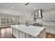 Bright kitchen featuring a large island, stainless steel appliances, and modern pendant lighting at 583 Carl Sanders Dr, Acworth, GA 30101