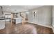 The living room boasts hardwood floors, an open-concept design, and custom lighting fixture at 583 Carl Sanders Dr, Acworth, GA 30101