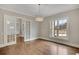 Bright living room with hardwood floors, ample natural light, and glass french doors at 583 Carl Sanders Dr, Acworth, GA 30101