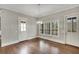 Living Room with large windows, doors and hardwood flooring throughout at 583 Carl Sanders Dr, Acworth, GA 30101