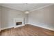 Bright living room featuring a fireplace and hardwood floors at 583 Carl Sanders Dr, Acworth, GA 30101