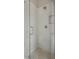 Shower featuring white tile and glass door at 583 Carl Sanders Dr, Acworth, GA 30101