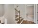 Staircase with wood treads and carpet runner leading to the upper level of the home at 583 Carl Sanders Dr, Acworth, GA 30101