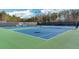 Bright blue tennis courts offer a vibrant space for recreational activities and friendly competition at 583 Carl Sanders Dr, Acworth, GA 30101