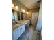 Spacious bathroom featuring double sinks, granite countertops, and modern fixtures at 183 Brookwood Xing, Douglasville, GA 30134