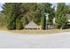 Entrance sign for the Brookwood community, surrounded by lush trees and landscaping at 183 Brookwood Xing, Douglasville, GA 30134