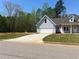 Lovely exterior showcasing a two-car garage and well-maintained landscaping at 183 Brookwood Xing, Douglasville, GA 30134